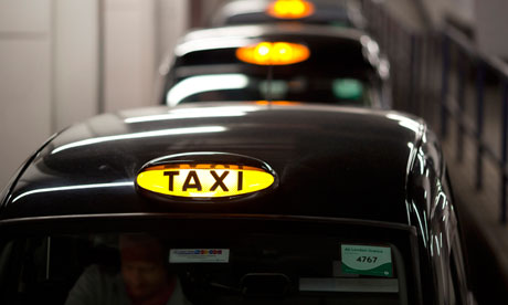 A queue of London taxis.